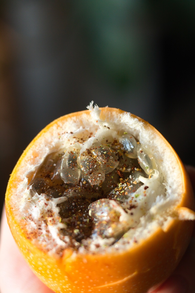 Granadilla fruit close-up with chili lime seasoning