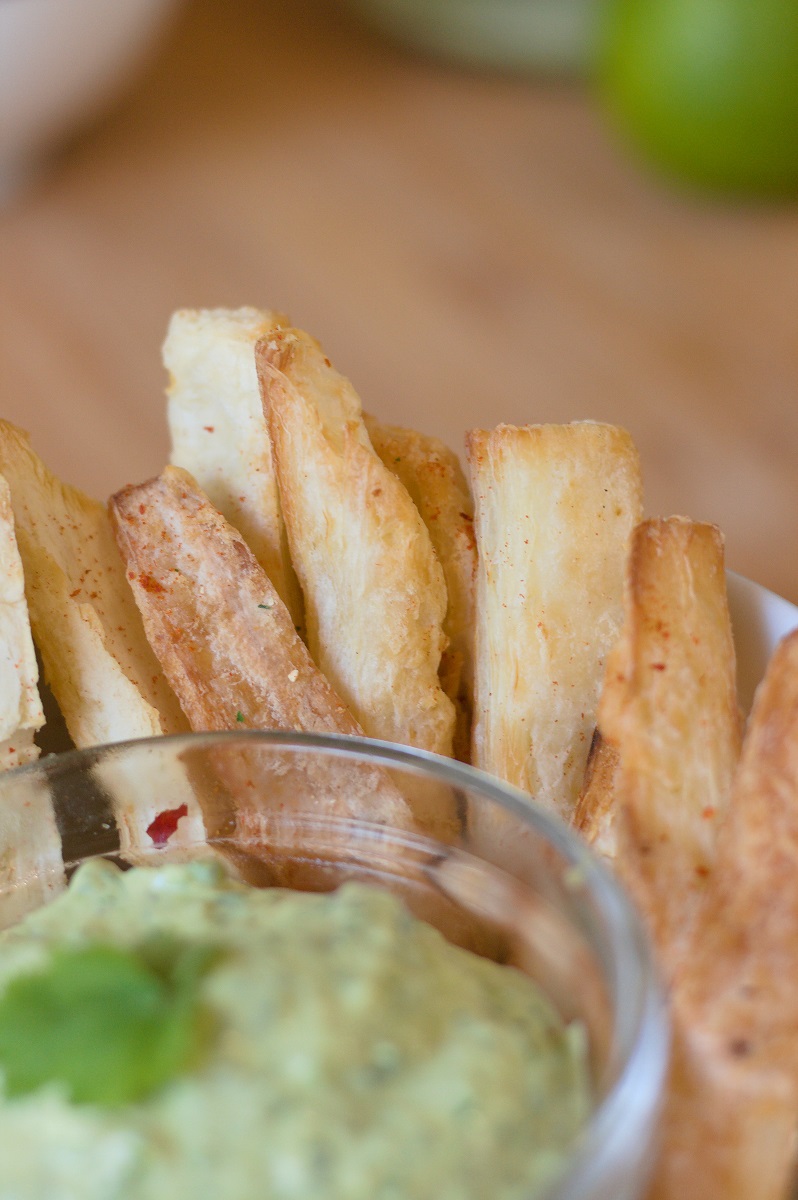 Close-up of yuca fries with chili lime seasoning.